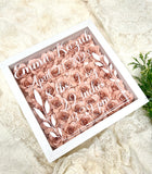 Baby birth stats Shadow box filled with rolled roses.
