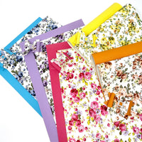 Wholesale Floral and solid colors faux leather sheets.