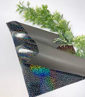 K166 Gray  double sided faux leather sheet. Black/silver holographic design backing