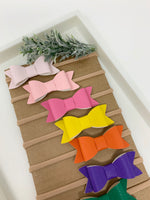 Set of 10 faux leather baby bows. Headbands
